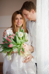 Young man congratulates his woman.