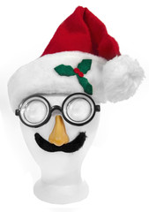 Goofy Santa face: cap,nerd glasses, nose, and mustache on styrofoam mannequin head. Isolated. Vertical. 