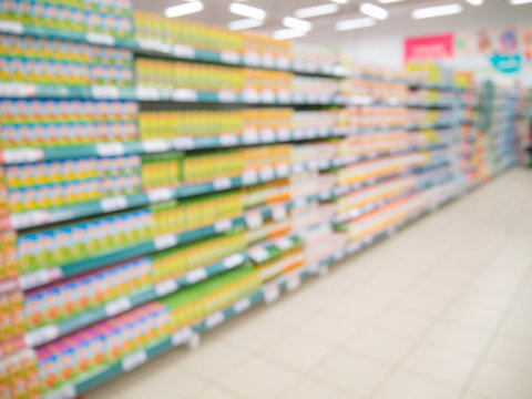 Blurred colorful supermarket products on shelves