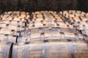 Whisky barrels full of whiskey in Scottish traditional distiller