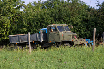 old truck parked in the landscape, dump old cars, junkyard