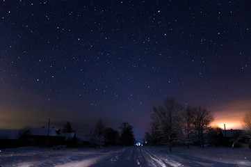 Fototapeta na wymiar road to snow village clear winter night