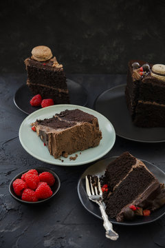Chocolate ganache layer cake slices on indigo background