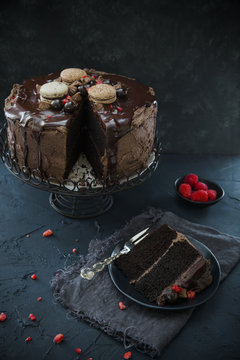 Chocolate ganache layer cake on indigo background