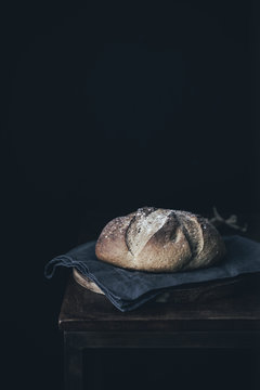 Rustic boule on old wooden table