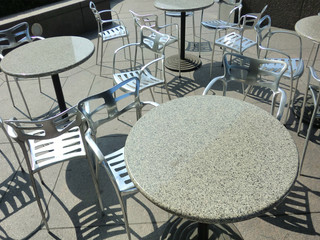 Unorganized patio furniture in outdoor cafe