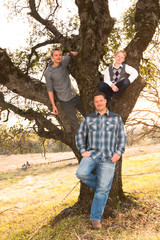 Father Standing With Sons up in The Oak Tree