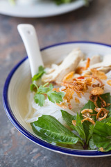 Pho ga- Vietnamese chicken noodle soup with crispy fried shallots and fresh herbs 