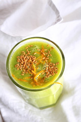 green smoothie with pineapple orange salad and flax seeds