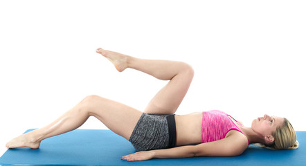 Obraz premium Woman making pilates mat exercises