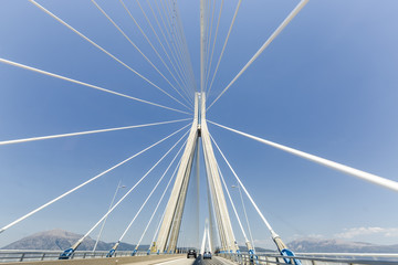 road to suspension bridge crossing Corinth Gulf strait, Greece