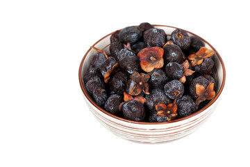 Dried Diospyros lotus or Wild Persimmon on white background. Selective focus.