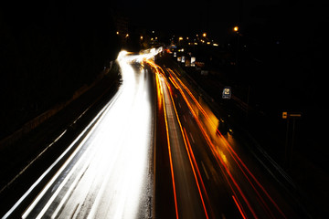 Light lines of fast driving car lights in the night. Slovakia