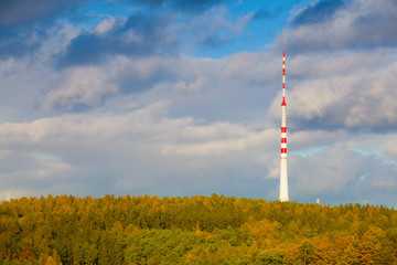 Obraz premium TV tower in the autumn forest