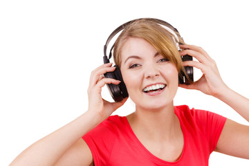 Fototapeta premium Woman in big headphones listening music isolated