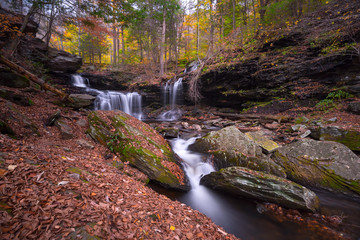 Waterfall cascading down the hill in the Rickets Glen State  Park