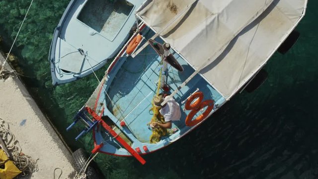 Man With a Fishnet on a Boat