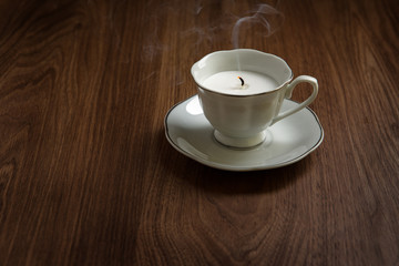 candle in a tea cups
