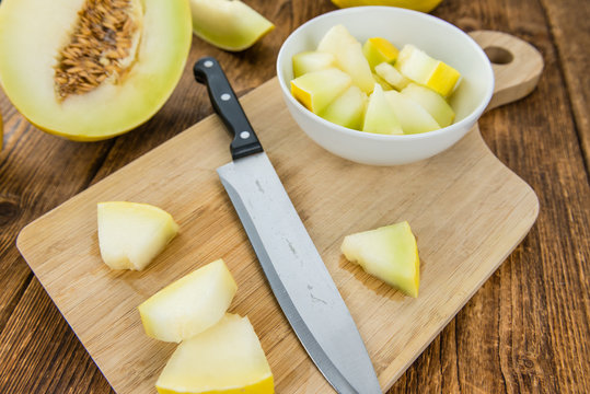 Wooden table with Honeydew Melon (selective focus)