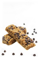 Chocolate chip granola bars isolated on white, selective focus