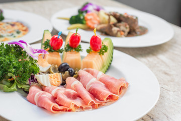 Prosciutto,Gammon,dried ham with melon and olives