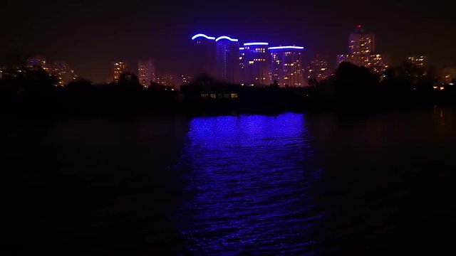 Night city view from the river, housing areas lights hd