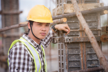 Naklejka na ściany i meble Happy Construction Worker On Building Site.
