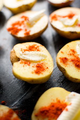 Raw potato with butter and red pepper