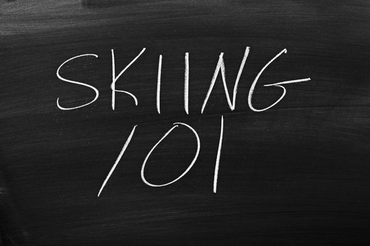 The words "Skiing 101" on a blackboard in chalk