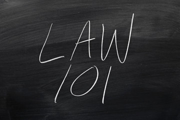 The words "Law 101" on a blackboard in chalk