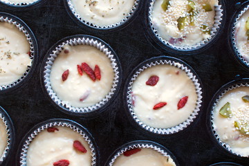 Raw muffins pastry in paper cups