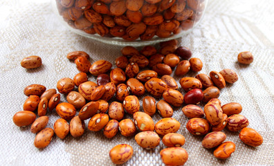Red beans grains in a glass jar on the table
