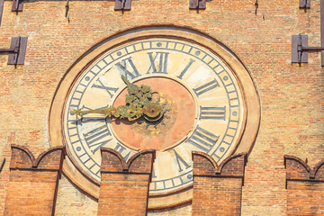 Close up of the ancient clock of Accursi palace tower , also known as the Palazzo Comunale d'Accursio, Piazza Maggiore square, Bologna in Italy.