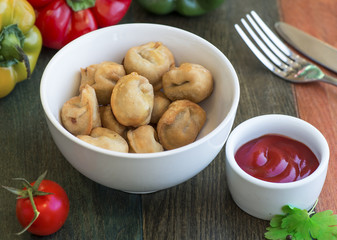 Very tasty nuggets with sauce and greens