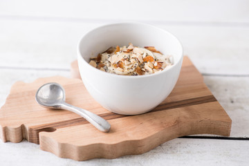 Muesli granola breakfast in a white bowl