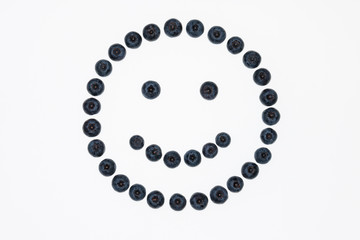 closeup of isolated blueberry face on white background