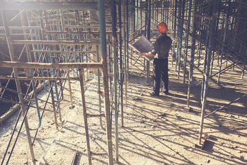 Engineer Architect working at Construction Site