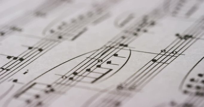 A musician or composer composes a song or a musical work, writing notes in pencil on the pentagram. The composer, first hears the sound of the note then writes and so on is composed the music. Concept