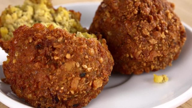 Some homemade Fried Falafel (not loopable; roating) as 4K UHD footage