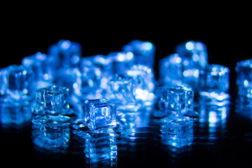 Blue ice cubes on the black background