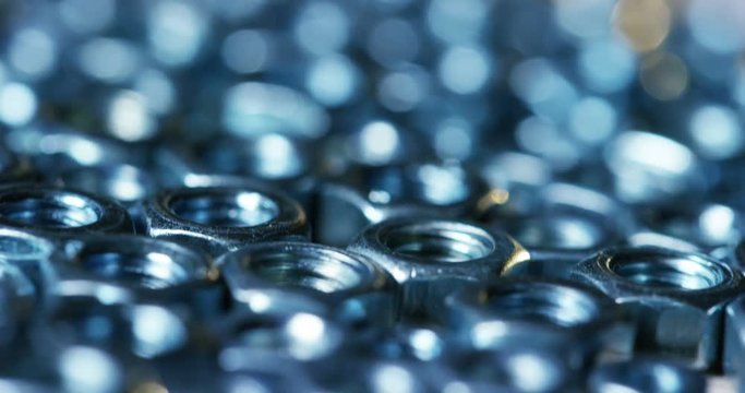 bolts and screws on a wooden work bench. concept of DIY and new screws or bolts. working tools in carpentry and home DIY. and self-tapping steel screws