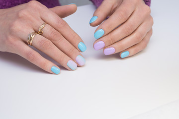 Amazing manicure and natural nails with gel polish. Attractive modern nail art design.