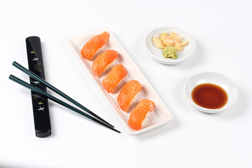 Fototapeta na wymiar Japanese food - Salmon sushi served with side dish.