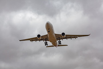 Passenger jet airplane low in the sky preparing to land
