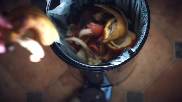 4k Shot of Composting Bin, Throwing to Trash Banana