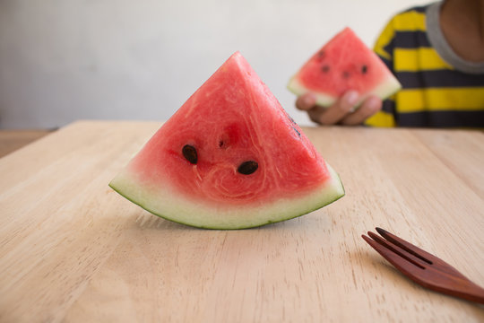 Slices of watermelon on wooden desk background