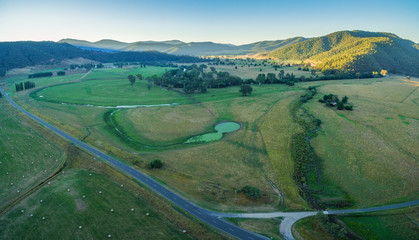 Aerial panorama of Australian meadows at sunset. Mitta Mitta valley, Victoria, Australia.