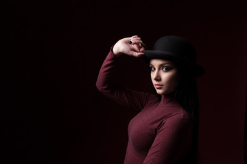Beautiful girl in a man's hat