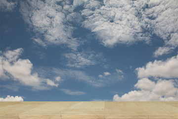 Wooden board with Blue sky background with cloudy.