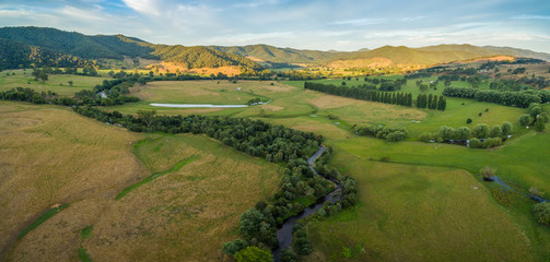 Aerial panorama of meadows and pastures of Mitta Mitta Valley near Eskdale, Victoria, Australia at sunset